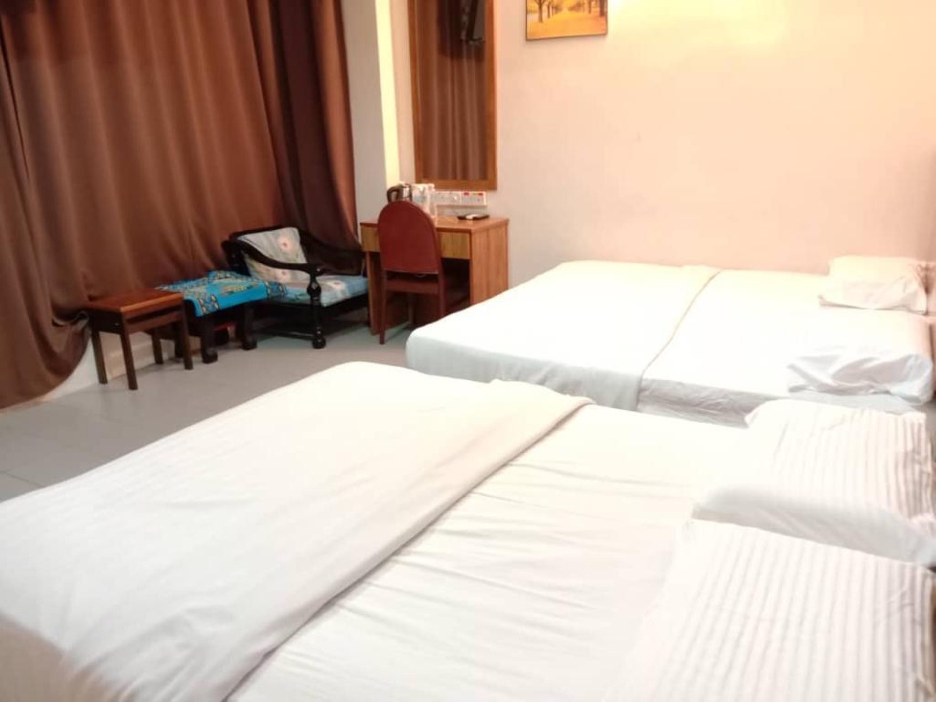 Oyo 89877 Sun Triang Hotel Kampong Kerayong Exteriör bild